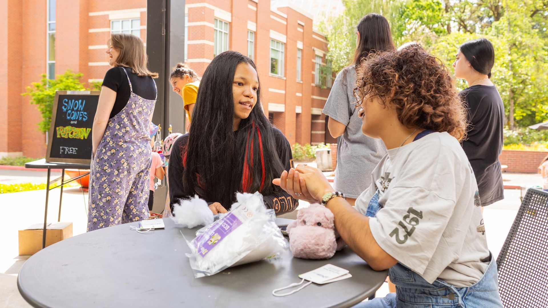 two students chat on campus
