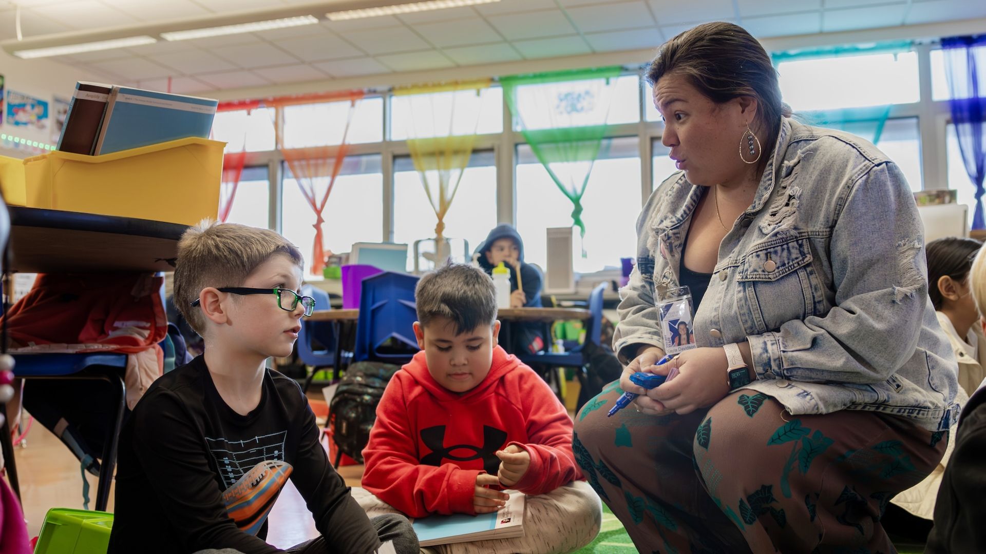 teacher smiling with students