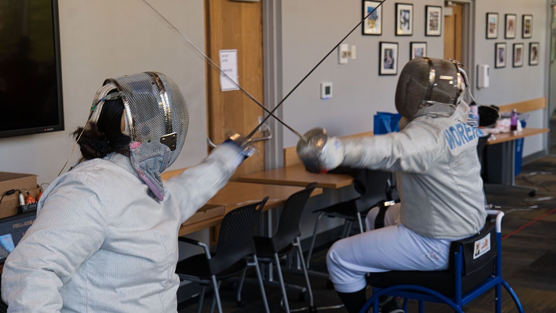 two Pacific University students fencing