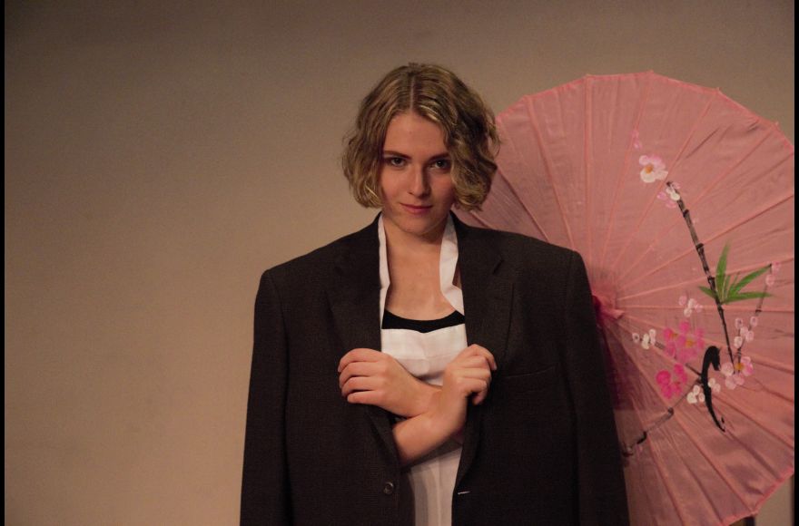 student performing in The Good Woman of Setzuan by Bertolt Brecht