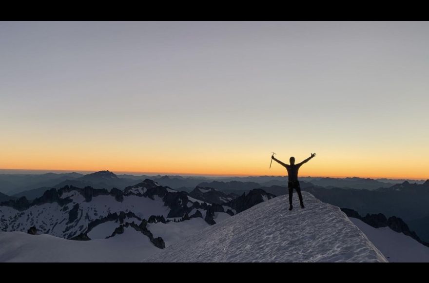 Pacific student summiting Eldorado Peak in the North Cascades.